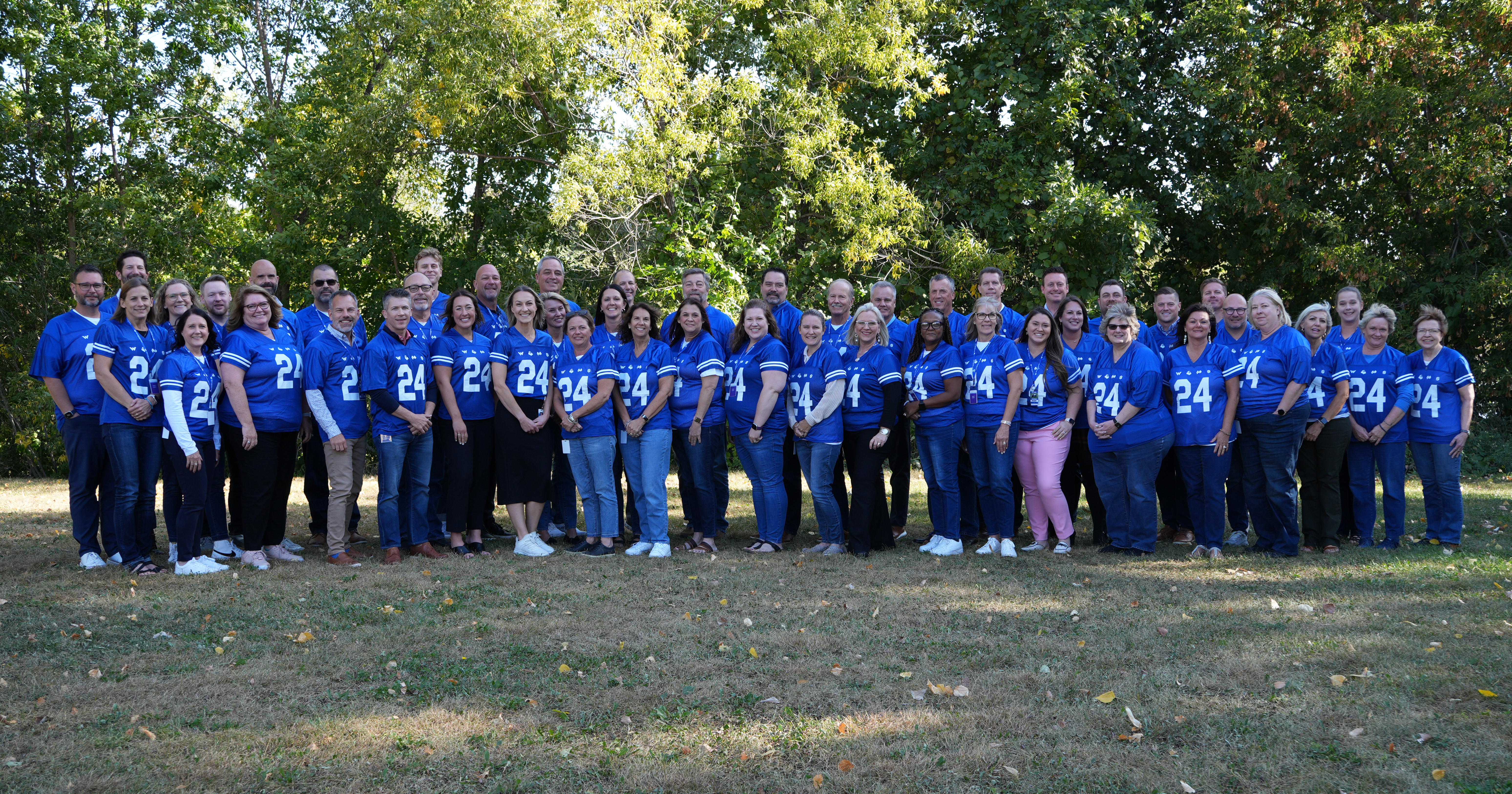 Western National Insurance Group employees posing for a group photo outside at the Sales and Underwriting Conference.